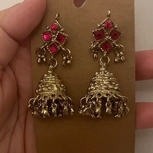 Gold Jhumka Earrings with Pink Gem Accents